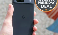 Google Pixel 7a in hand with Expert Reviews approved deal sticker cropped